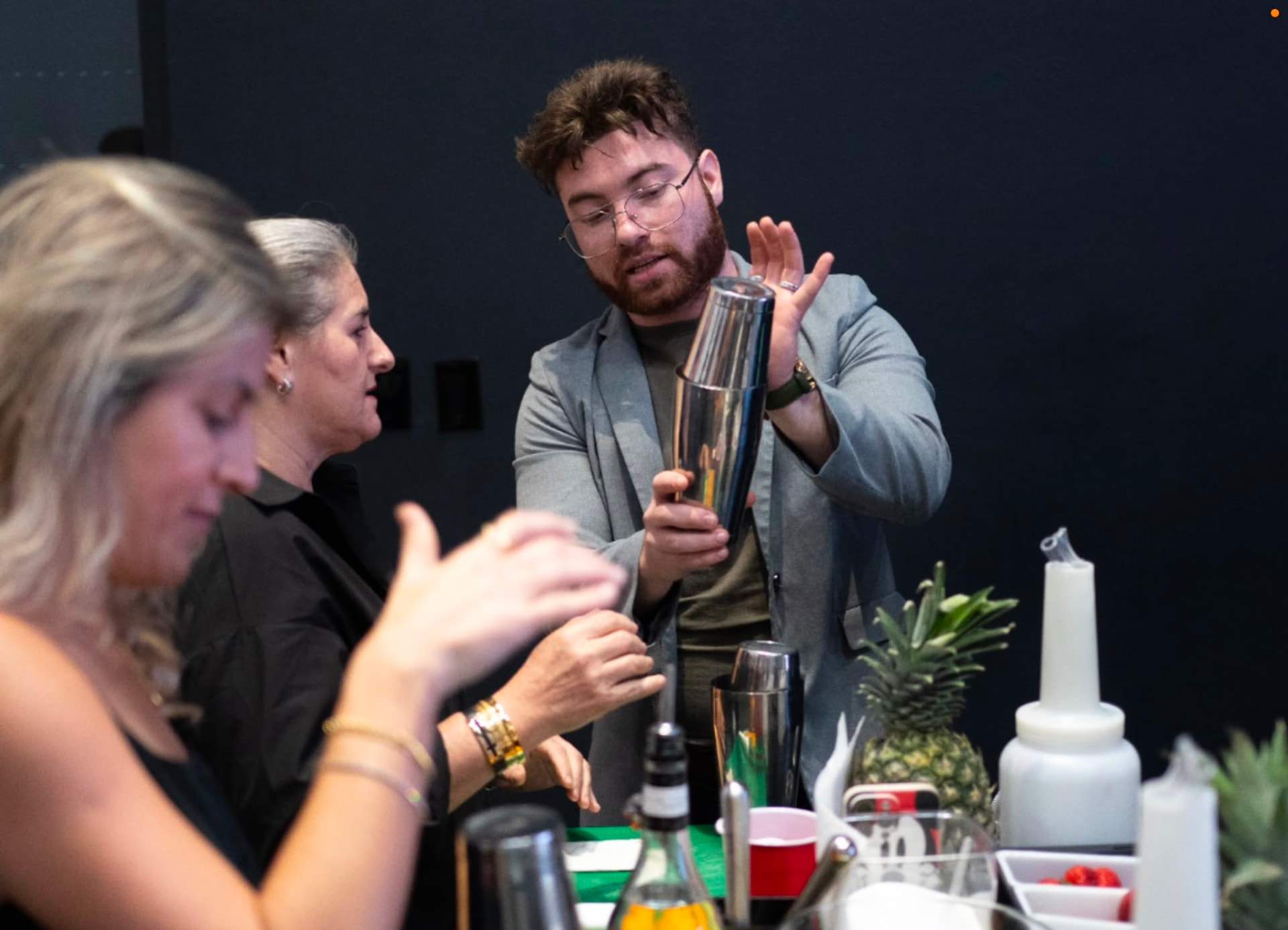 Pedro Pacheco teaching shaking technique to students at the bar station